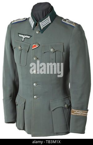 A field tunic of a medical director of the Division 'Feldherrnhalle', Private purchase piece made of field-grey gabardine with dark-green collar, field-grey buttons, grey silk lining, hand-embroidered officer's eagle, sewn shoulder boards and collar patches, the left arm with original sewn sleeve band 'Feldherrnhalle'. The stitching on the left shoulder somewhat loosened (can easily be mended). infantry, military, armed forces, militaria, object, objects, stills, clipping, clippings, cut out, cut-out, cut-outs, historic, historical 20th century, Additional-Rights-Clearance-Info-Not-Available Stock Photo