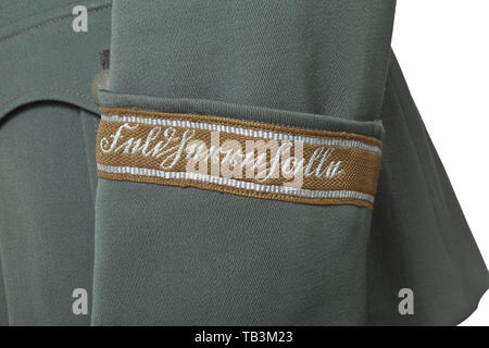 A field tunic of a medical director of the Division 'Feldherrnhalle', Private purchase piece made of field-grey gabardine with dark-green collar, field-grey buttons, grey silk lining, hand-embroidered officer's eagle, sewn shoulder boards and collar patches, the left arm with original sewn sleeve band 'Feldherrnhalle'. The stitching on the left shoulder somewhat loosened (can easily be mended). infantry, military, armed forces, militaria, object, objects, stills, clipping, clippings, cut out, cut-out, cut-outs, historic, historical 20th century, Additional-Rights-Clearance-Info-Not-Available Stock Photo