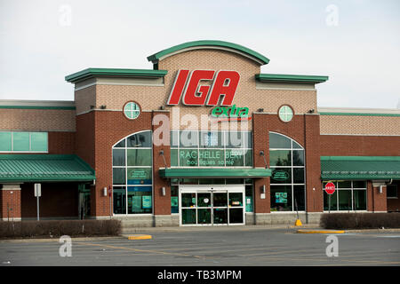 A Logo Sign Outside Of A Iga Retail Grocery Store Location In
