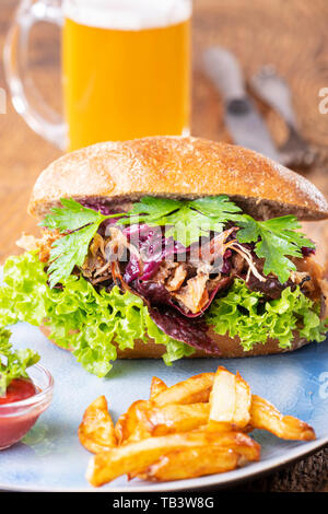 pulled pork in a bun with beer Stock Photo
