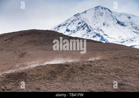 Snow- capped Mount volcanoes, volcanic massive, one of the volcanic complex on the Kamchatka Peninsula in the far east of Russia. Pacific ring fire. Stock Photo