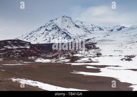 Snow- capped Mount volcanoes, volcanic massive, one of the volcanic complex on the Kamchatka Peninsula in the far east of Russia. Pacific ring fire. Stock Photo