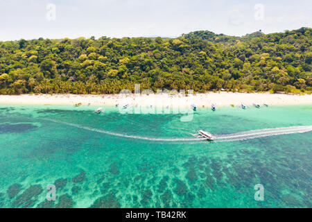 Puka Shell Beach, Boracay Island, Philippines, aerial view. Tropical white sand beach and beautiful lagoon. Tourist boats and people on the beach. Peo Stock Photo