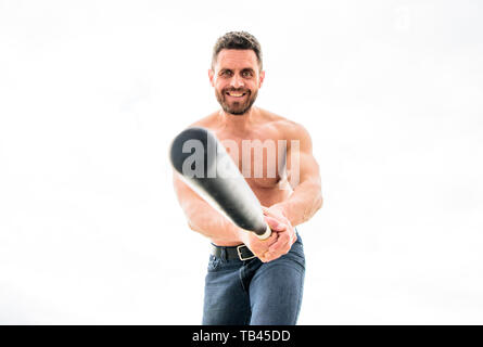Victory requires payment in advance. Man with baseball bat. Hooligan hits bat. Bandit aggression anger. Muscular man fighting. Violence and attack. Street fight. Attack and defence. Get ready attack. Stock Photo