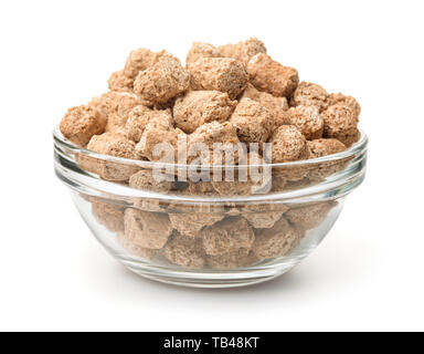 Glass bowl of extruded oats bran pellets isolated on white Stock Photo