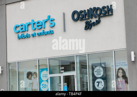 A logo sign outside of a Carter's, Inc., and OshKosh B'gosh retail store  location in Vaudreuil-Dorion, Quebec, Canada, on April 21, 2019. (Photo by  Kristoffer Tripplaar/Sipa USA Stock Photo - Alamy