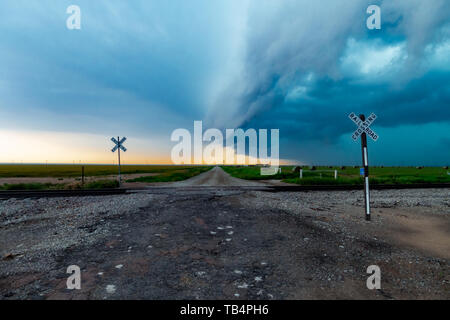 Squall Line converging over a gravel road from a North Texas Super Cell Stock Photo