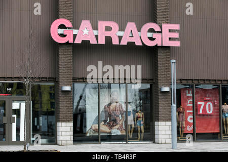 A logo sign outside of a Garage Clothing retail store location in Vaudreuil-Dorion, Quebec, Canada, on April 21, 2019. Stock Photo