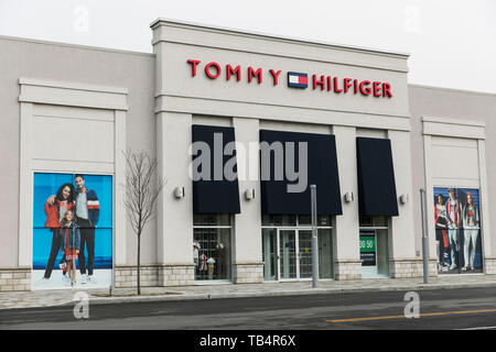 A sign outside of a Tommy Hilfiger store location in Quebec, Canada, on April 21, Stock Photo - Alamy