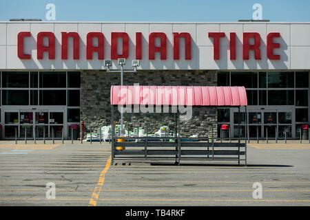 A logo sign outside of a Canadian Tire retail store location in Montreal, Quebec, Canada, on April 21, 2019. Stock Photo
