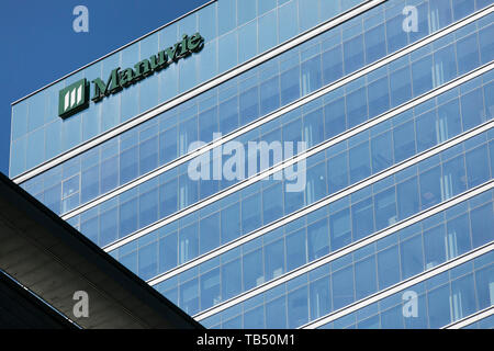 A logo sign outside of a facility occupied by Manuvie (Manulife Financial Corporation) in Montreal, Quebec, Canada, on April 21, 2019. Stock Photo