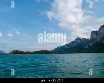 Scenic landscape of boat view in the big river and reservoir dam with mountain and nature forest