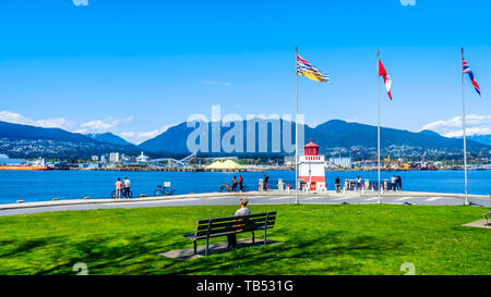 The Lighthouse at Brockton Point on the famous Seawall pathway in Vancouver's famous Stanley Park in British Columbia, Canada Stock Photo