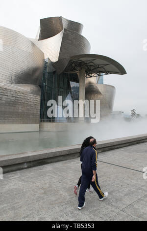 The Guggenheim museum is shrouded in Ms Fujiko Nakaya's, a Japanese artist, mist. Architect Frank Gehry.