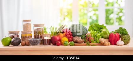 balanced diet, cooking, culinary and food concept,close up of vegetables, fruit,nut and cereal on wooden table Stock Photo