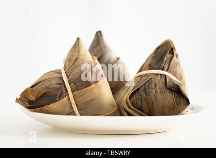 three traditional rice dumplings on table Stock Photo