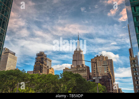 New York City. Empire State Building, Skyscrapers and Cloudy Blue Sky Stock Photo