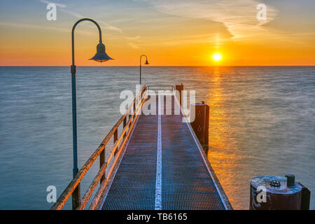Pier at the german baltic sea coast at sunrise Stock Photo