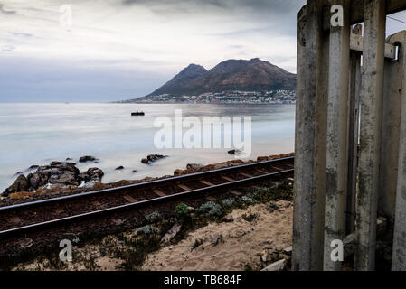 The coastal railway along False Bay, in South Africa's Western Cape province on the Cape Peninsula, near the city of Cape Town Stock Photo