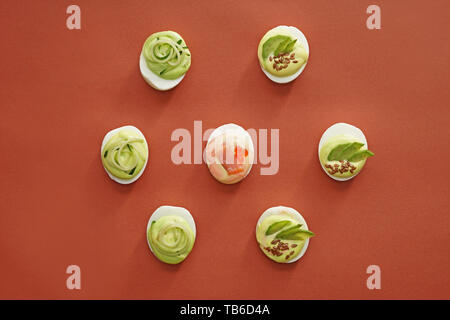 Tasty deviled eggs on color background Stock Photo