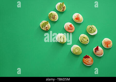 Tasty deviled eggs on color background Stock Photo
