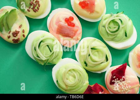 Tasty deviled eggs on color background Stock Photo