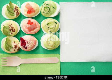 Composition with tasty deviled eggs on color background Stock Photo