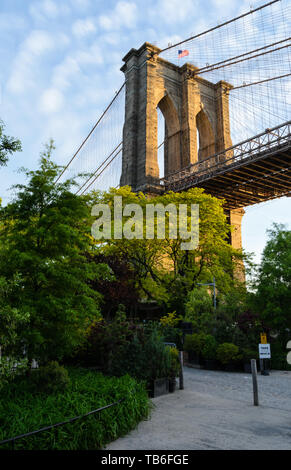 One of the pillars of the Brooklyn Bridge shining in the sun, New York City, USA Stock Photo