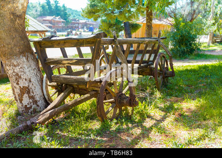 old abandoned wooden wagon on a farm Stock Photo