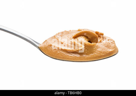 Peanut spread in spoon isolated on white background Stock Photo