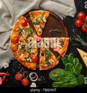 Sliced Pizza With Cherry Tomatoes And Rocked Salad Closeup, Top View Stock Photo