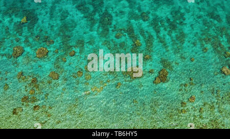 Transparent sea water copy space for text, top view. Aerial view of calm sea water. Top view of a clean ocean water near a coast. Stock Photo