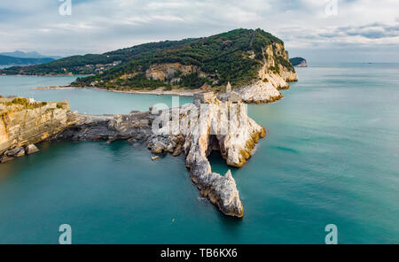 Beautiful aerial view of the Gothic-style Church of St. Peter (Chiesa di San Pietro) sitting atop a rocky headland in Porto Venere village on the Ligu Stock Photo