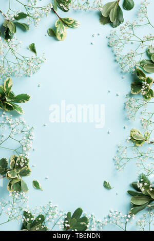 Small white gypsophila flowers on pastel blue background. Women's Day, Mother's Day, Valentine's Day, Wedding concept. Flat lay. Top view. Copy space. Stock Photo