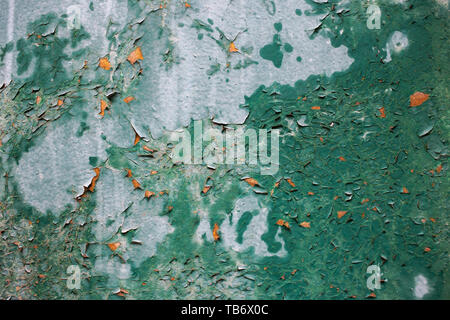 Wooden surface with cracked paint. Green paint. Stock Photo