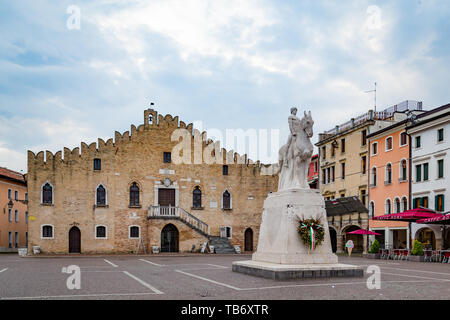 Portogruaro, Veneto Italy - May 22, 2019: Cityscape with St. Andrea clock tower, city hall and the WWI monument in Piazza della Republica Stock Photo
