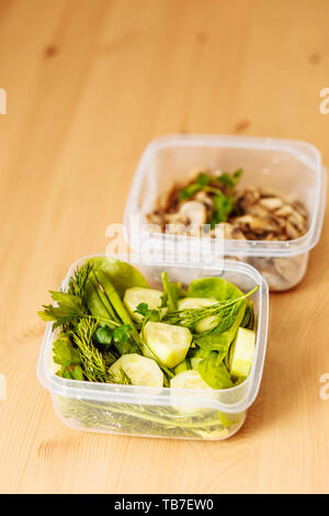 https://l450v.alamy.com/450v/tb7ew0/healthy-meal-prep-containers-with-vegetables-and-mushrooms-on-a-wooden-background-closeup-photo-tb7ew0.jpg