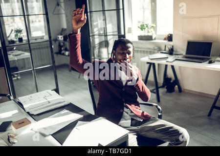 Businessman feeling very sleepy after working too much Stock Photo