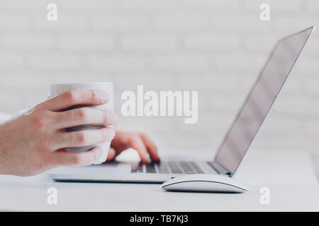 Young business person man working with notebook at workplace Stock Photo