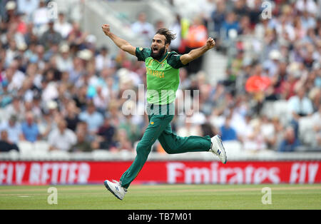 South Africa's Imran Tahir celebrates taking the wicket of England's Eoin Morgan during the ICC Cricket World Cup group stage match at The Oval, London. Stock Photo