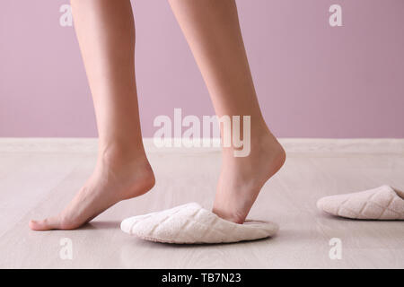 Young woman walking on tiptoe without slippers at home Stock Photo