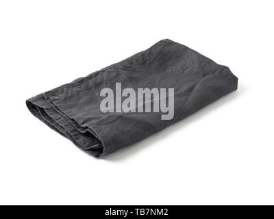 Side view on folded dark black linen napkin isolated on white background. Anthracite grey linen napkin. Isolated on white with clipping path. Stock Photo