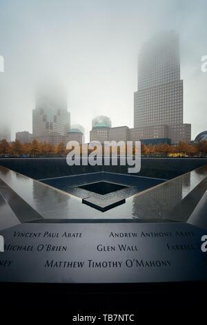 NEW YORK CITY -  NOV 12: September 11 memorial in a foggy day on November 12 Stock Photo