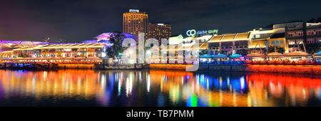 SINGAPORE - APR 5: Clarke Quay at night with street view and restaurant on April 5,2013 in Singapore As a historical riverside quay,it is now the h. Stock Photo