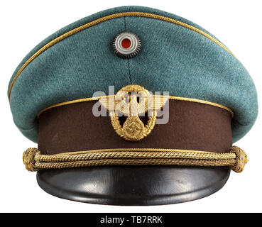 A visor cap for generals of the police, Made of fine police-green gabardine cloth, dark brown trim band, gold piping. Golden-yellow silk lining (cap trapezoid is missing), the light brown leather sweatband with the manufacturer's mark 'Fraenkel Wien'. Gilt police eagle. Gold cap cord (some damage). Used visor cap. historic, historical 20th century, Editorial-Use-Only Stock Photo