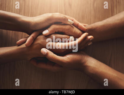 Top view of couple holding their hands Stock Photo