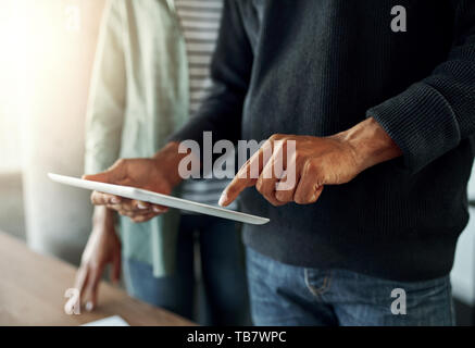 Close-up of a man using digital tablet Stock Photo
