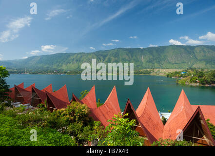 Traditional Batak roof architecture in Tuk Tuk on Samosir Island, Lake Toba, , Sumatra, Indonesia Stock Photo