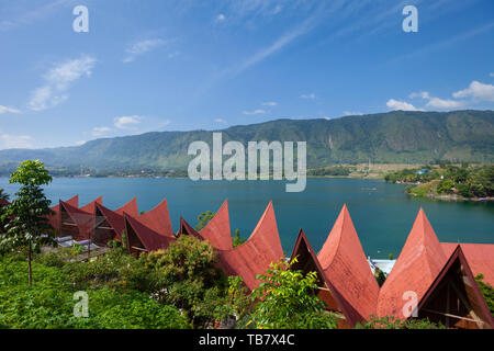 Traditional Batak roof architecture in Tuk Tuk on Samosir Island, Lake Toba, , Sumatra, Indonesia Stock Photo