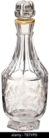 Hermann Göring - a large crystal carafe produced by Baccarat for his 50th birthday in 1943, Made of cut glass, the stopper in the shape of four acorns, the spout with a gold trim, the neck faceted, the carafe round-bellied and decorated with engraved oak leaves, a large helmeted Göring family coat of arms in a medallion in the centre, octagonal base. Height 32.5 cm. Extremely rare. Hermann Göring's 50th birthday on 12 January 1943 was the last major social event of the Third Reich. In vying for the Reich Marshal's favour, leading figures from the military, politics and indu, Editorial-Use-Only Stock Photo